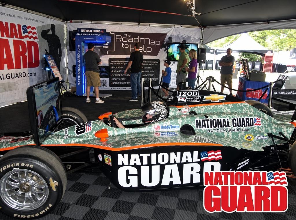 National Guard IZOD IndyCar Series display at a public event with spectators